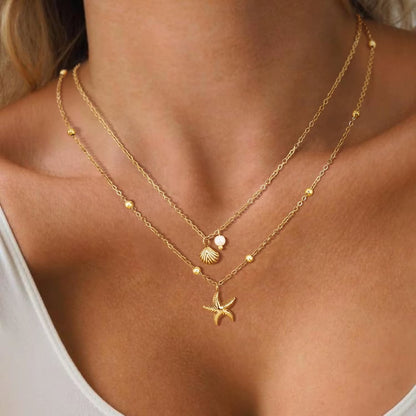 Women Shell Necklace 14K Gold Plated Stainless Steel Layered Starfish Conch Seashell Pearl Charm Necklace Summer Beach Jewelry